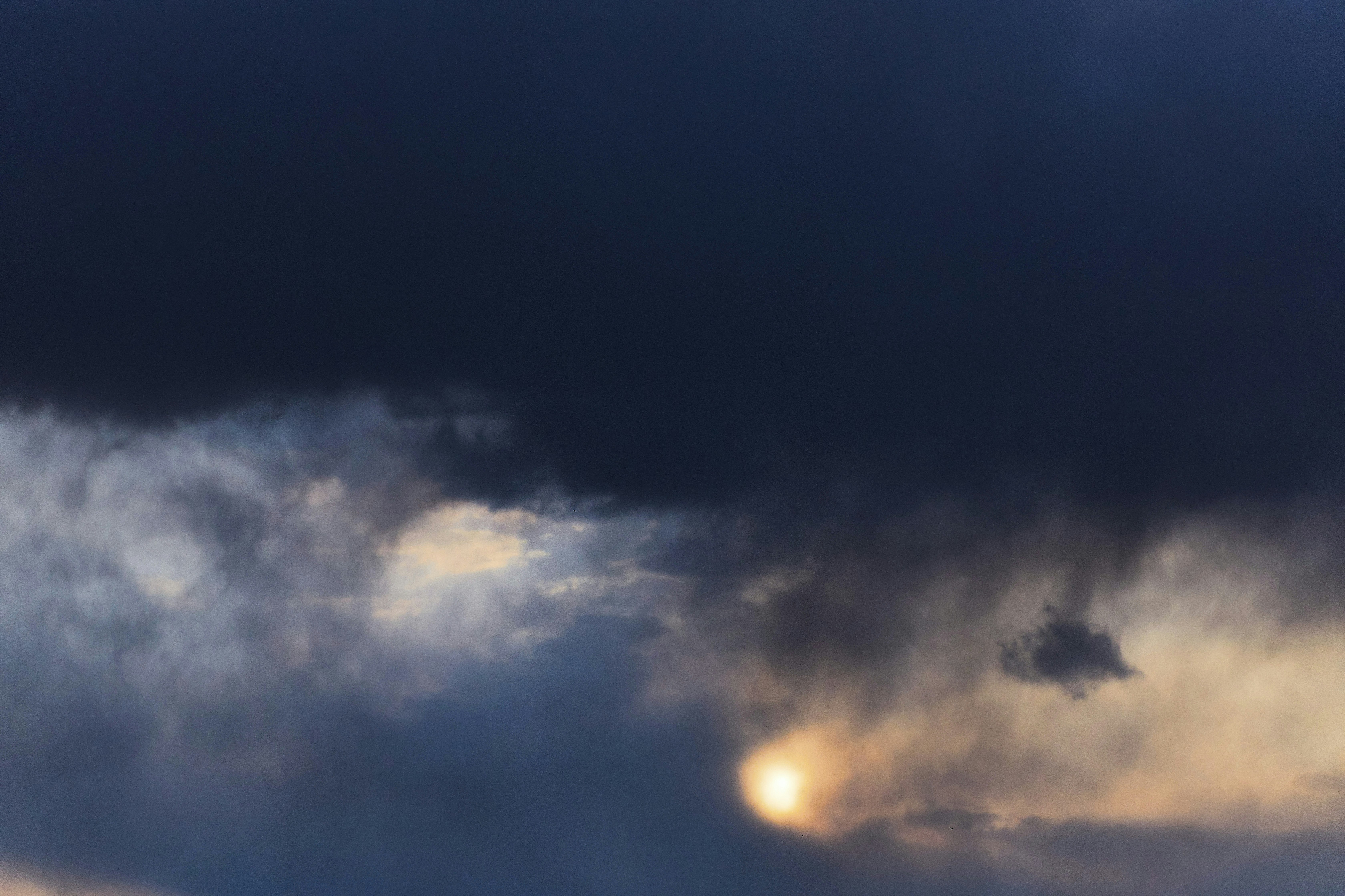 blue sky with white clouds during night time